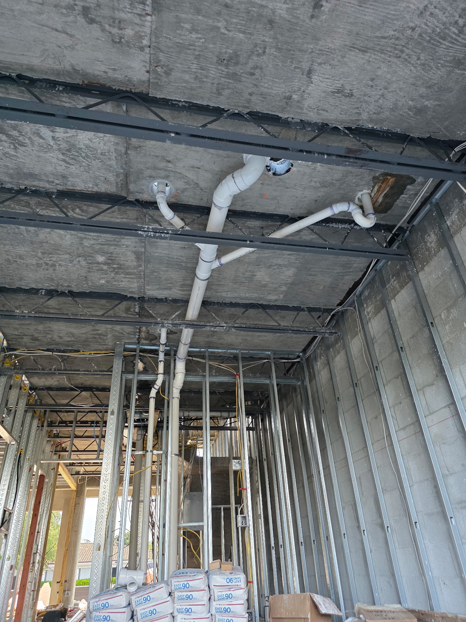 Overhead branch drain and vent rough-in
